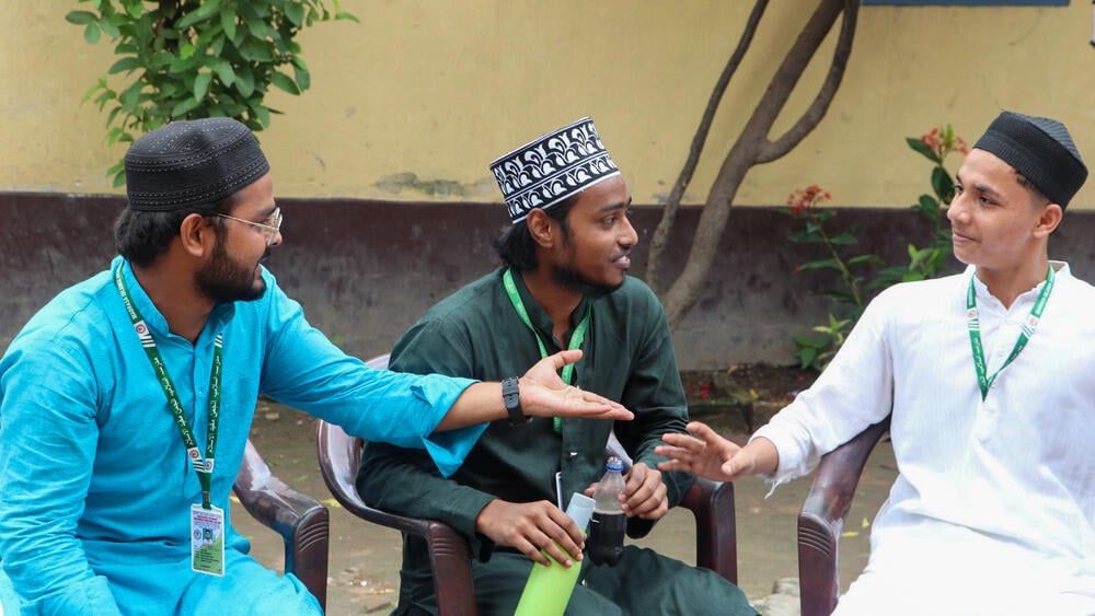 Altamash (middle), with his friends and classmates enacting a substance abuse skit (with mock bottles) in his hand