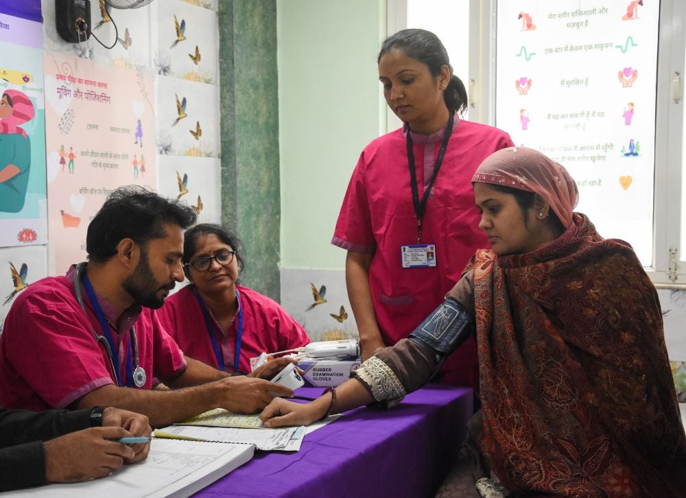 Figure 2: Seema and her husband with their team of midwives.