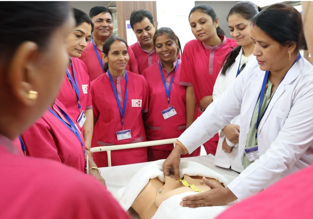 Figure 12: Midwives being trained using dummy mannequin.