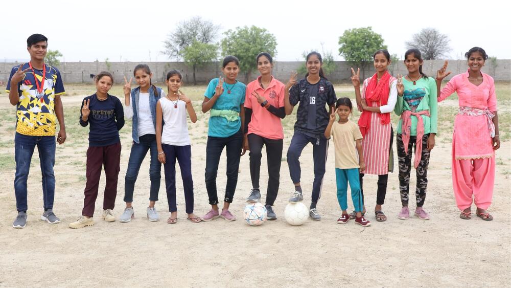 Manish, on the field with his team